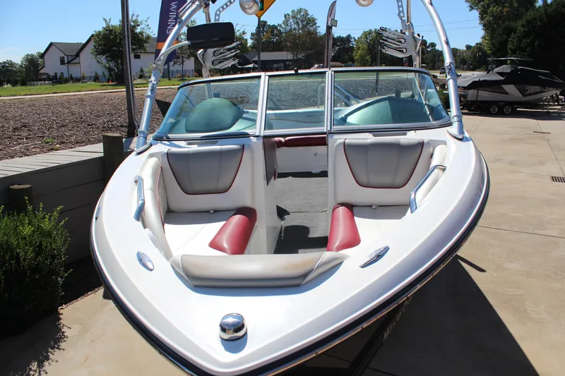 Slide: The Image of 2011 MasterCraft X-15 boat with sleek design and comfortable seating in a sunny outdoor setting. - 7