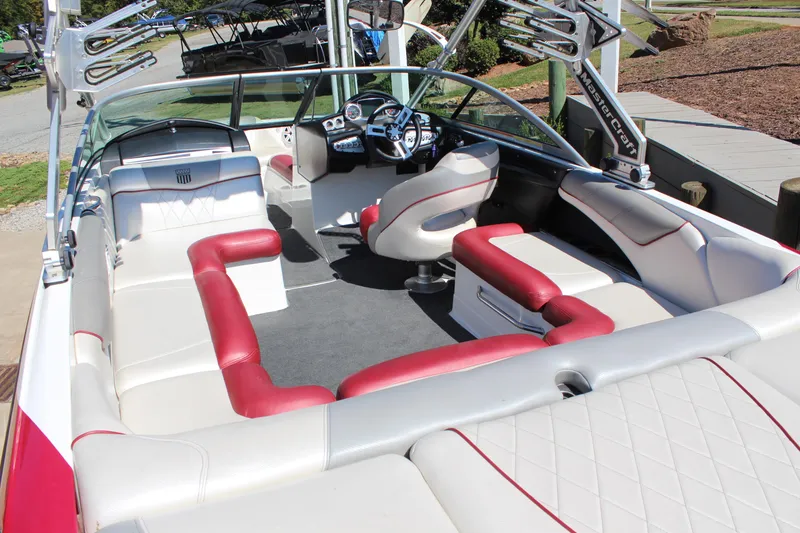 Slide: The Image of 2011 MasterCraft X-15 boat interior with red and white seating, sleek design. - 9