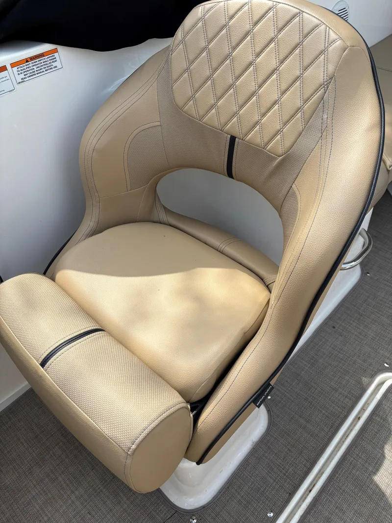 Slide: The Image of 2022 Bayliner VR6 Bowrider I/O seat with beige upholstery and diamond stitching. - 5