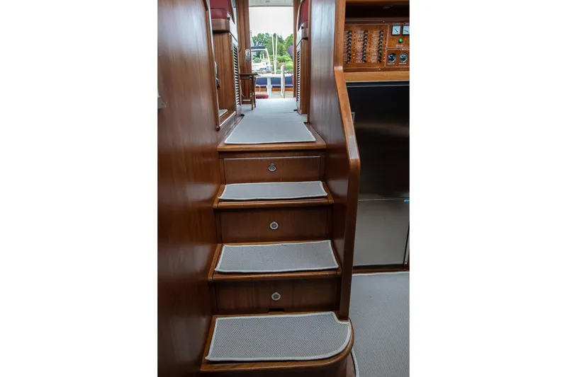 Slide: The Image of Staircase inside 2008 Vicem 52 Classic yacht, featuring wooden finish and carpeted steps. - 11