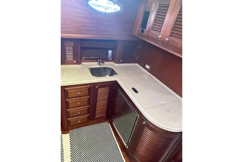 Slide: The Image of Luxurious wooden galley interior of 2008 Vicem 52 Classic yacht with sink and cabinets. - 13