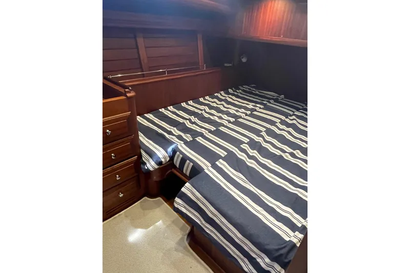 Slide: The Image of Luxurious cabin interior of 2008 Vicem 52 Classic yacht with striped bedding. - 16