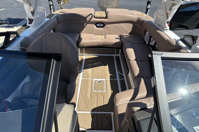 Slide: The Image of 2026 Centurion Ri230 boat interior with luxurious seating and modern design. - 12