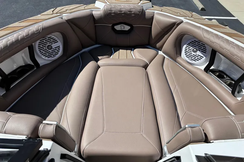 Slide: The Image of 2026 Centurion Ri230 boat interior with luxurious seating and advanced audio system. - 8