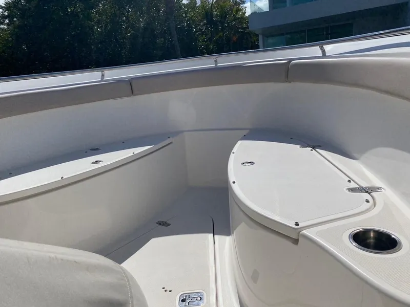 Slide: The Image of 2015 Pursuit S 280 Sport boat interior with seating and storage compartments. - 13
