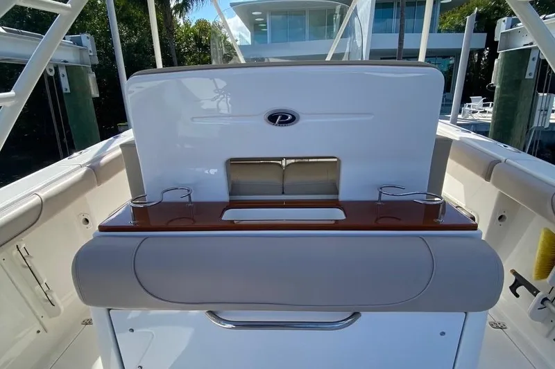 Slide: The Image of 2015 Pursuit S 280 Sport boat interior with seating and storage. - 15