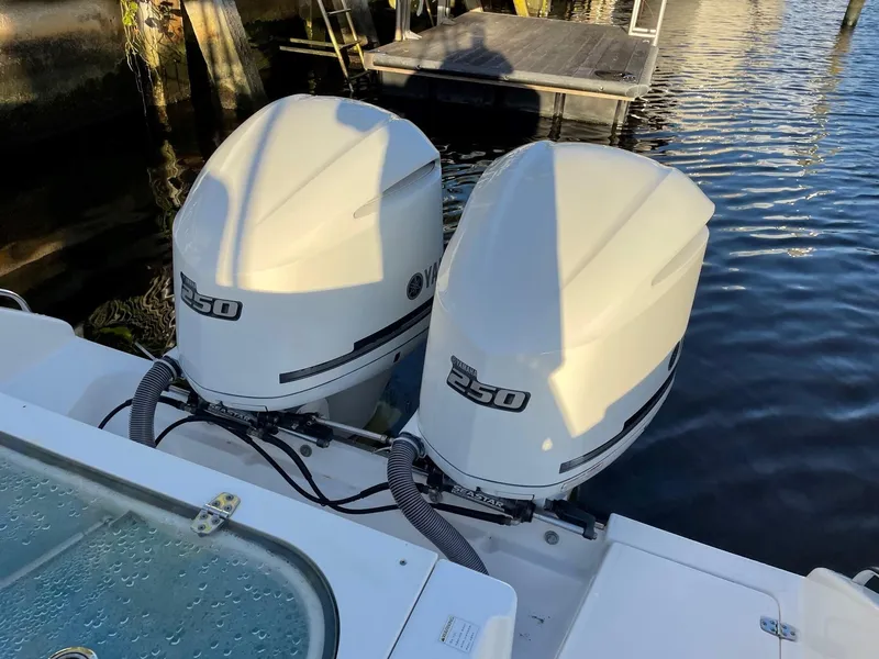 Slide: The Image of Twin Yamaha 250 outboard engines on a 2015 Pursuit S 280 Sport boat. - 22