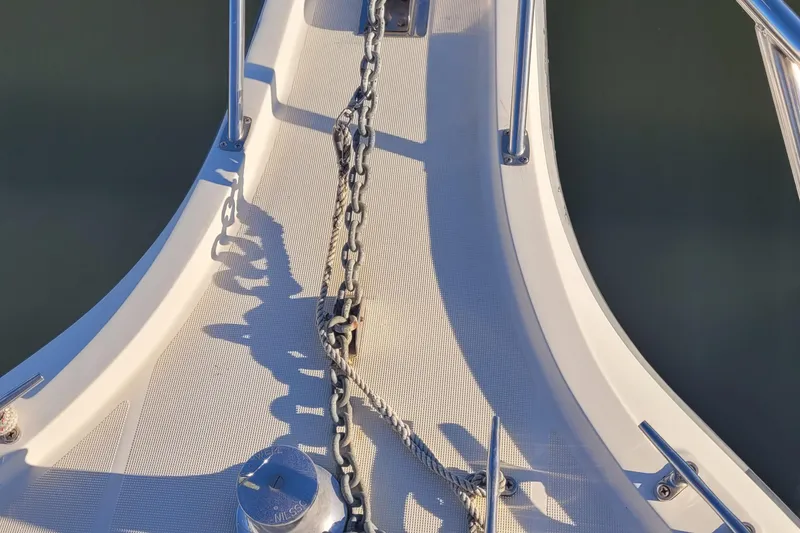 Slide: The Image of Bow of 1988 Tiara Yachts 3600 Convertible with anchor chain and rope. - 15