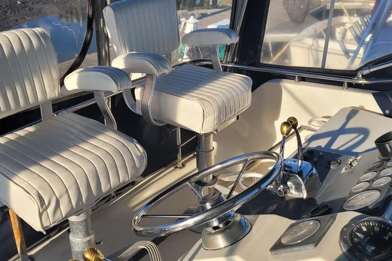 Slide: The Image of Interior of 1988 Tiara Yachts 3600 Convertible, featuring helm and seating area. - 21