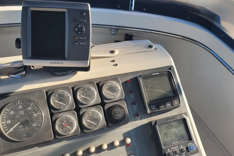 Slide: The Image of Dashboard of a 1988 Tiara Yachts 3600 Convertible with Garmin and Raymarine equipment. - 23