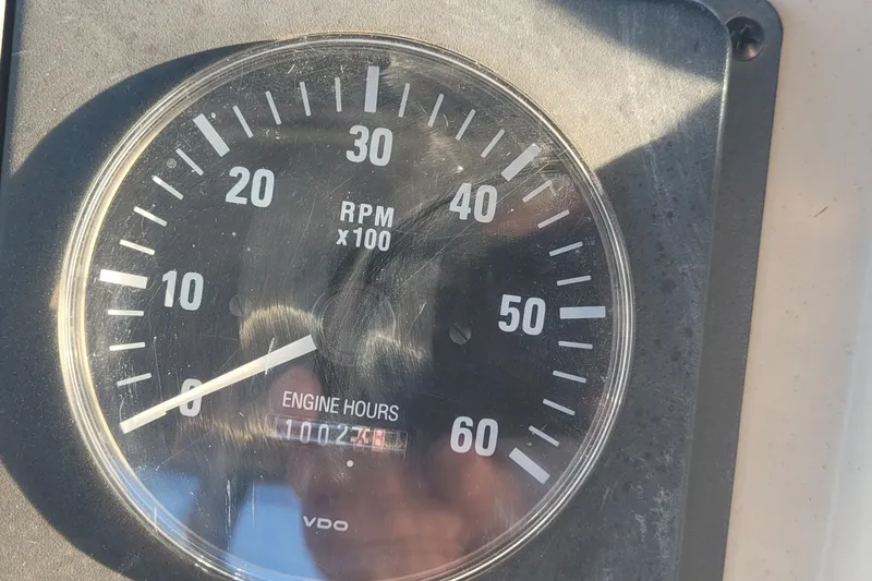 Slide: The Image of Close-up of a Tiara Yachts 3600 Convertible 1988 tachometer showing RPM and engine hours. - 26