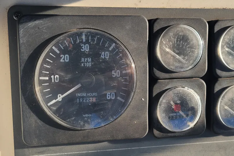 Slide: The Image of Dashboard gauges of a 1988 Tiara Yachts 3600 Convertible, showing RPM and engine hours. - 28