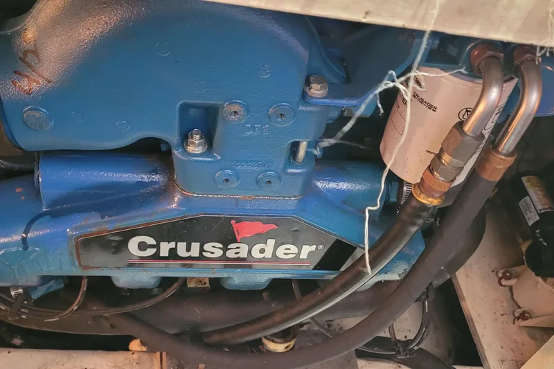 Slide: The Image of Engine of a 1988 Tiara Yachts 3600 Convertible with Crusader branding. - 31