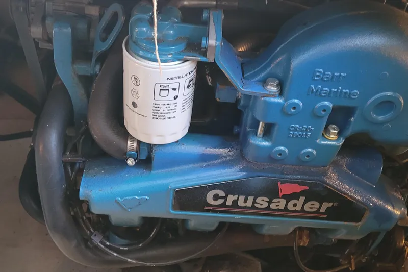 Slide: The Image of Engine of a 1988 Tiara Yachts 3600 Convertible with Crusader branding. - 37