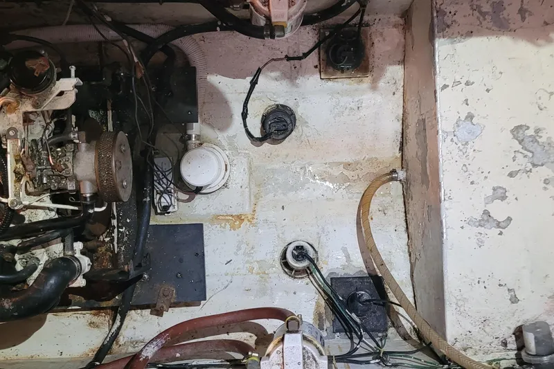 Slide: The Image of Engine compartment of a 1988 Tiara Yachts 3600 Convertible, showing mechanical components and wiring. - 38