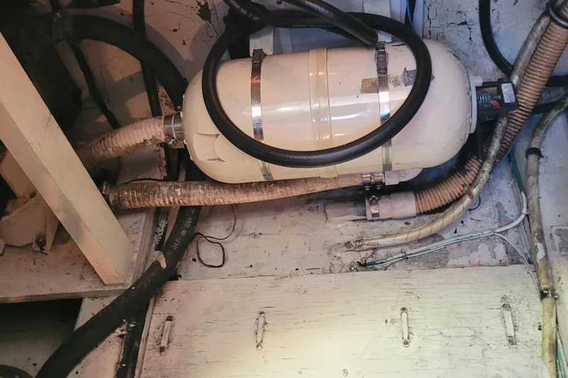 Slide: The Image of Engine room of 1988 Tiara Yachts 3600 Convertible with plumbing and equipment. - 40