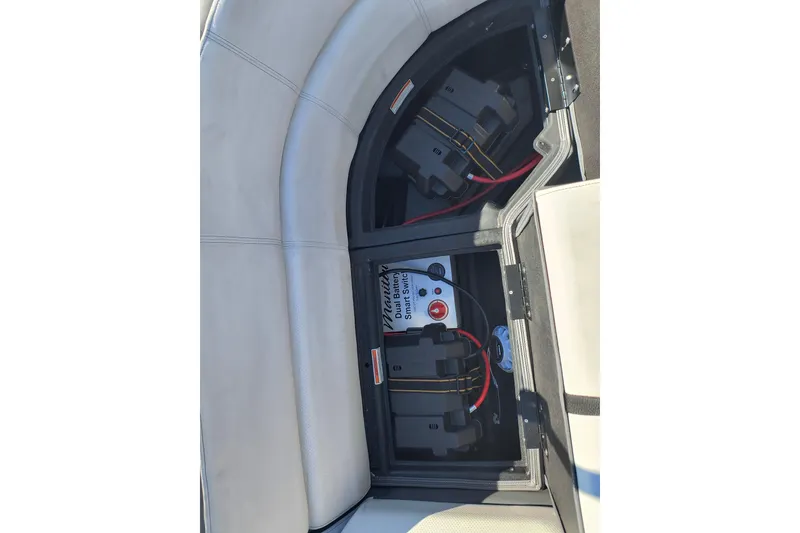 Slide: The Image of Battery compartment of 2022 Manitou Aurora VP 23 pontoon boat with Smart Switch system. - 22