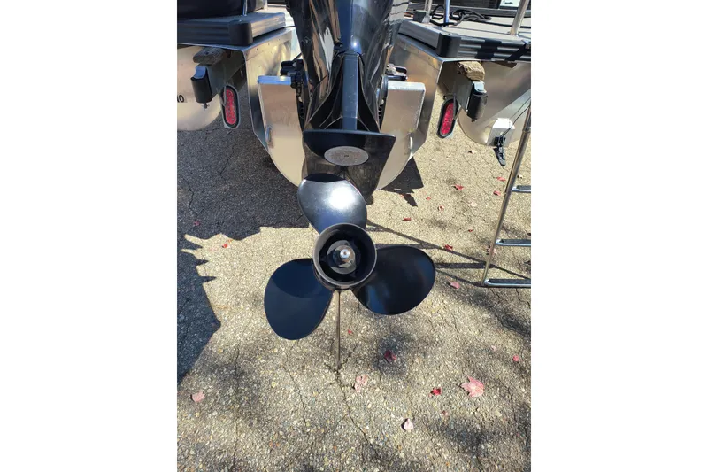 Slide: The Image of 2022 Manitou Aurora VP 23 boat propeller and rear view in sunlight. - 30