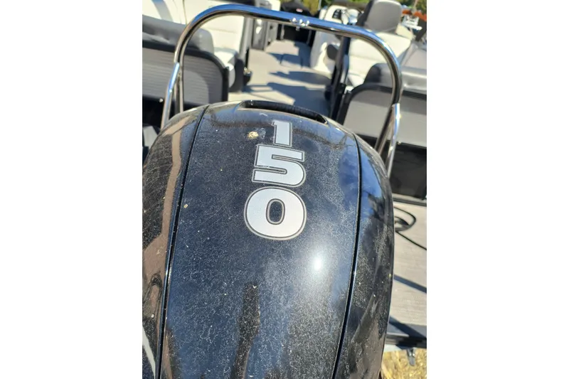 Slide: The Image of 2022 Manitou Aurora VP 23 boat with a 150 horsepower engine. - 31