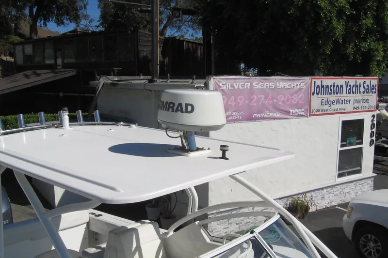 Slide: The Image of 2024 Edgewater 248CX Crossover boat at Johnston Yacht Sales dealership. - 15