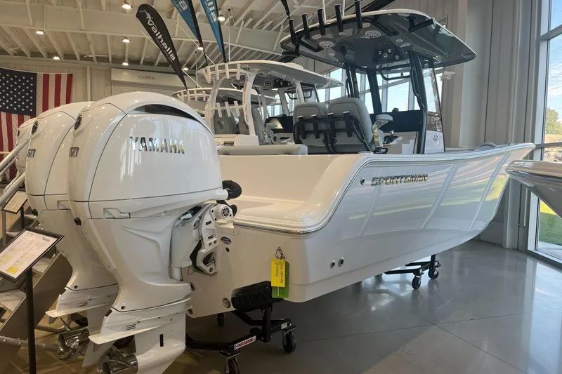 The Image of 2026 Sportsman Open 252 Center Console boat with Yamaha engines in showroom. - 0