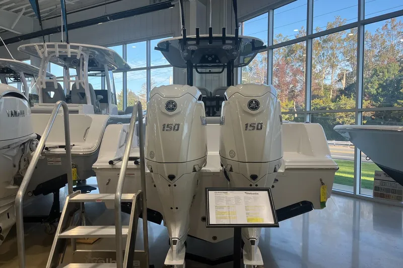 Slide: The Image of 2026 Sportsman Open 252 Center Console with twin 150 engines in showroom. - 5