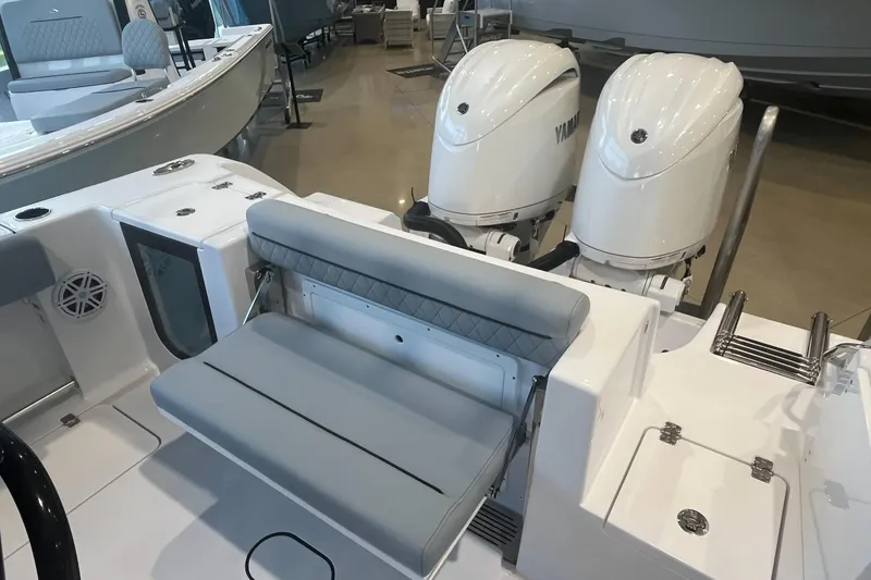 Slide: The Image of 2026 Sportsman Open 252 Center Console with dual outboard engines and seating. - 8