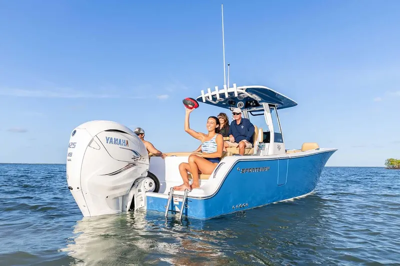 Slide: The Image of Manufacturer Provided Image: 2025 Sportsman Heritage 261 Center Console boat on water with people enjoying the ride. - 3