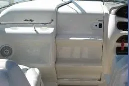 Slide: The Image of 1998 Sea Ray 280 Cuddy Cabin interior, featuring sleek white dashboard design. - 3