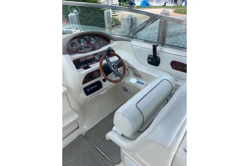 Slide: The Image of 1998 Sea Ray 280 Cuddy Cabin helm with steering wheel and instrument panel. - 5