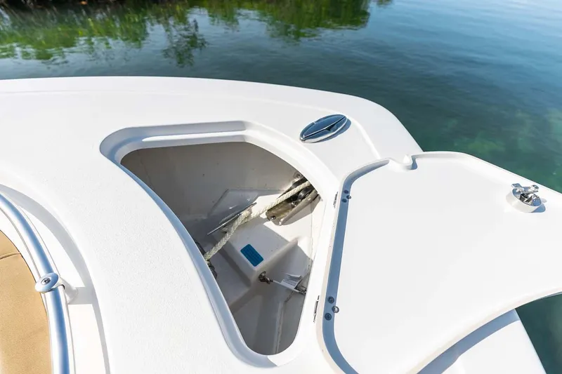 Slide: The Image of Manufacturer Provided Image: 2025 Sportsman Heritage 261 Center Console anchor locker open on calm water. - 23