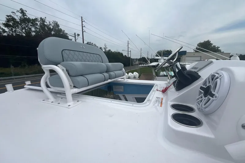 Slide: The Image of 2026 Sportsman Open 262 Center Console boat with seating and control panel. - 4