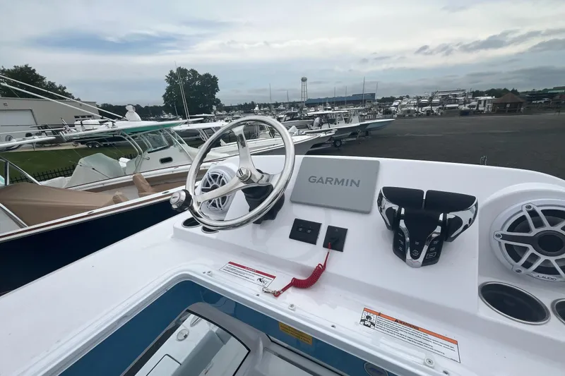 Slide: The Image of 2026 Sportsman Open 262 Center Console boat dashboard with Garmin navigation system. - 5