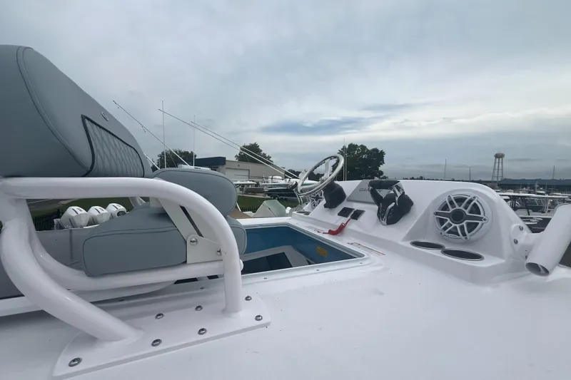 Slide: The Image of 2026 Sportsman Open 262 Center Console boat interior with steering wheel and seating. - 6