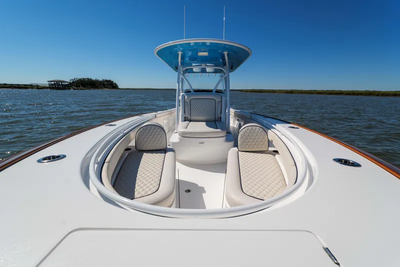 Slide: The Image of 2024 Valhalla Boatworks V-33 on water, featuring luxurious seating and sleek design. - 10