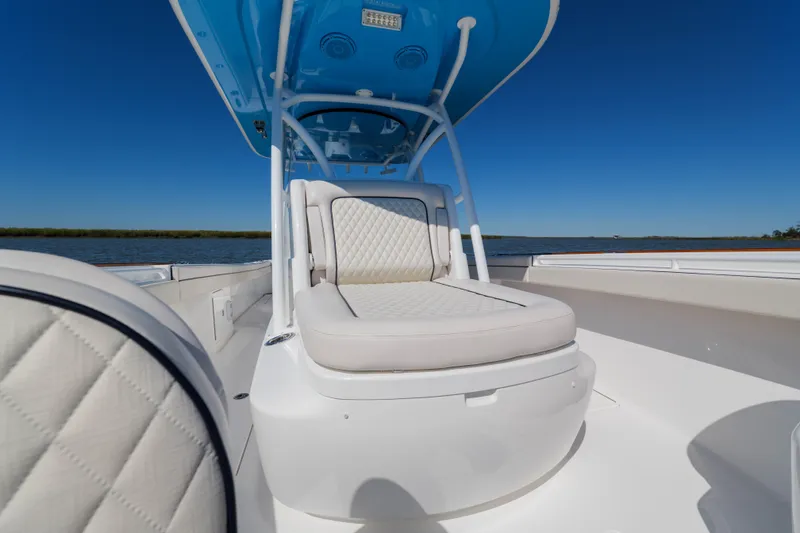 Slide: The Image of 2024 Valhalla Boatworks V-33 with luxurious seating, under a clear blue sky. - 11