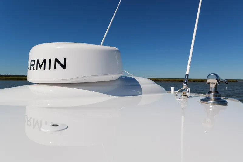 Slide: The Image of 2024 Valhalla Boatworks V-33 with Garmin equipment on deck, clear blue sky background. - 19