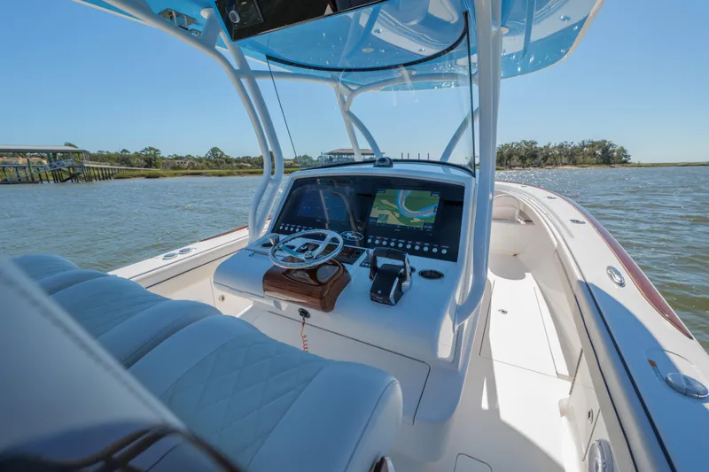 Slide: The Image of 2024 Valhalla Boatworks V-33 helm with navigation display on open water. - 22
