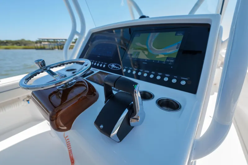 Slide: The Image of 2024 Valhalla Boatworks V-33 helm with advanced navigation display and controls. - 25