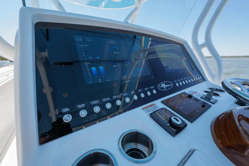 Slide: The Image of 2024 Valhalla Boatworks V-33 dashboard with advanced navigation and control systems. - 26