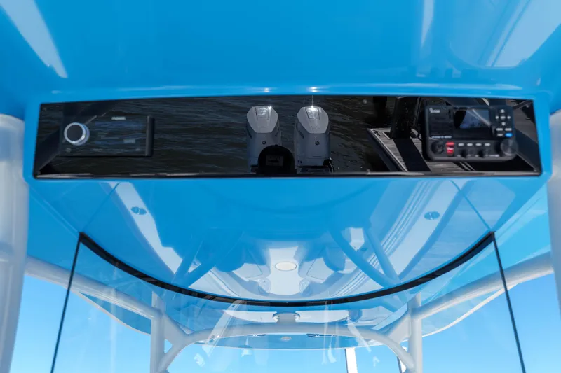 Slide: The Image of 2024 Valhalla Boatworks V-33 dashboard with modern controls and blue canopy. - 28