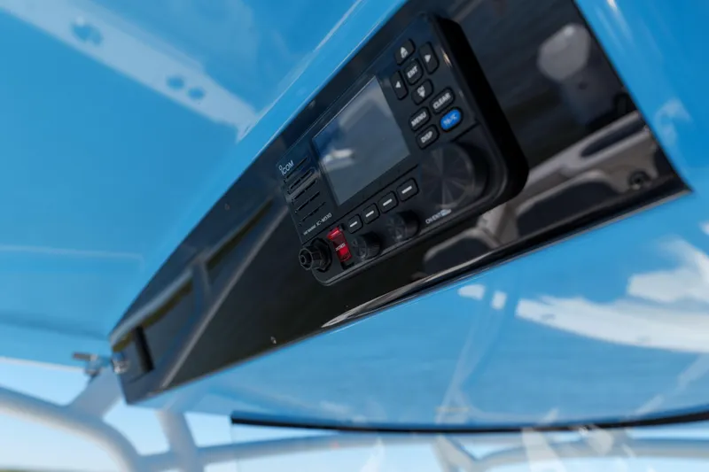 Slide: The Image of 2024 Valhalla Boatworks V-33, featuring a modern control panel under a blue canopy. - 29