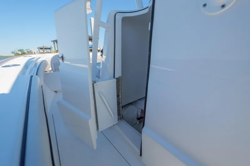 Slide: The Image of 2024 Valhalla Boatworks V-33 cabin entrance with open door, showcasing sleek design. - 33