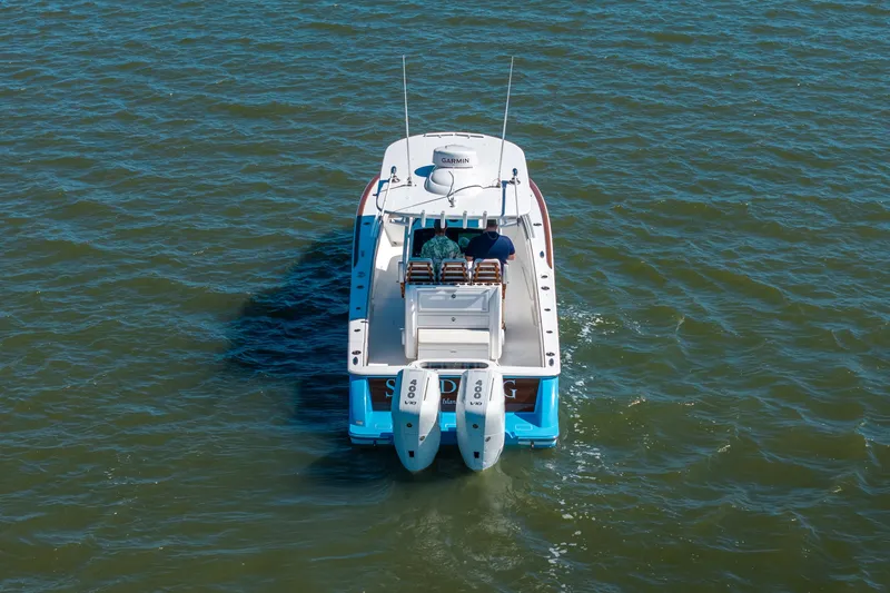 Slide: The Image of 2024 Valhalla Boatworks V-33 cruising on open water, rear view. - 43