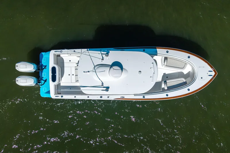 Slide: The Image of Overhead view of 2024 Valhalla Boatworks V-33 on water, showcasing sleek design and dual engines. - 44