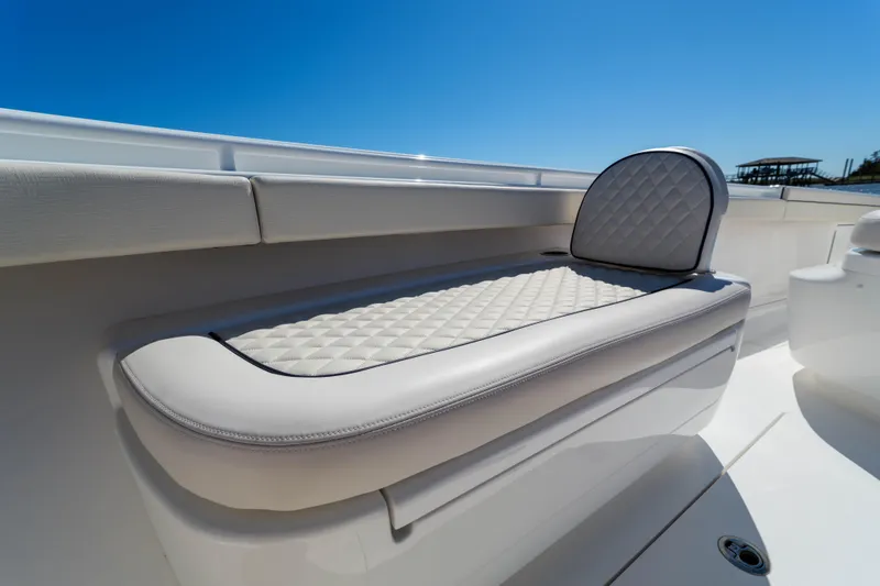 Slide: The Image of 2024 Valhalla Boatworks V-33, featuring luxurious quilted seating under a clear blue sky. - 6