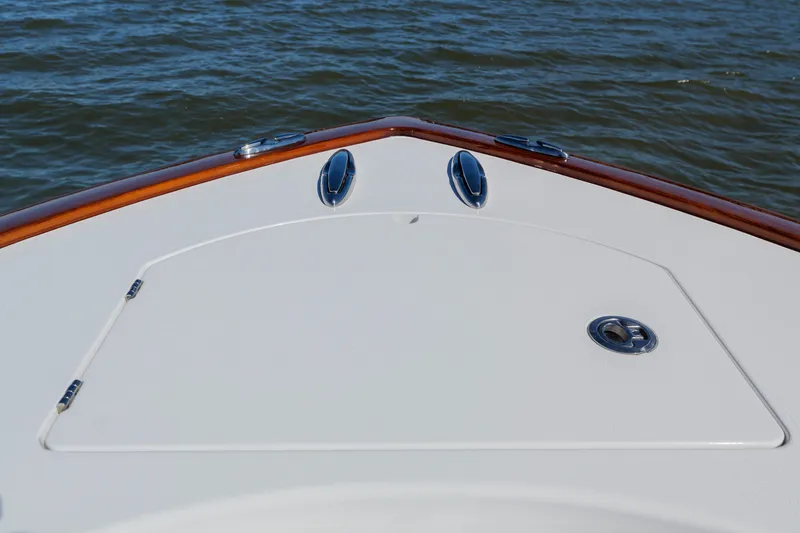 Slide: The Image of 2024 Valhalla Boatworks V-33 bow detail on calm water. - 8
