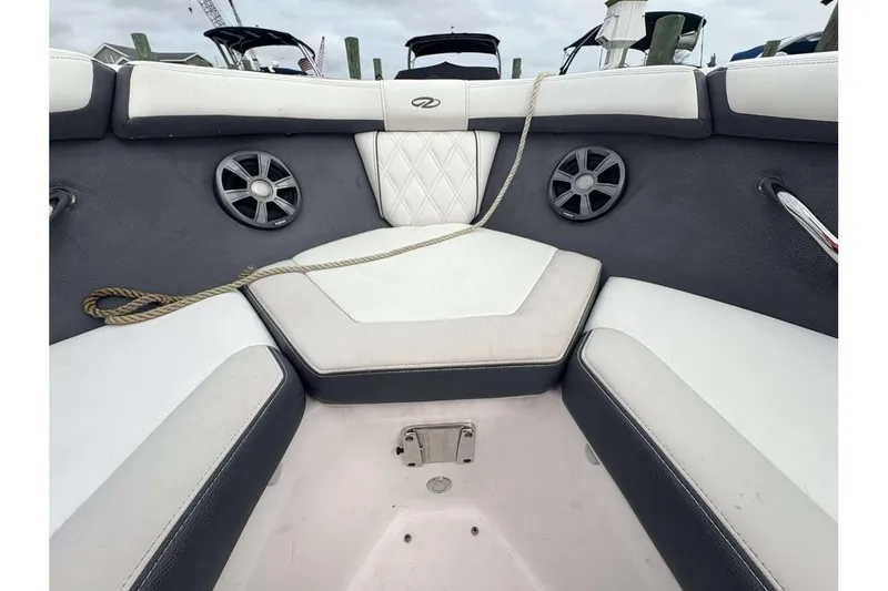 Slide: The Image of Interior of 2018 Regal 21 OBX boat with cushioned seating and speakers. - 16
