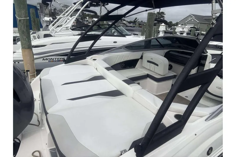 Slide: The Image of 2018 Regal 21 OBX boat interior with white seating and sleek design. - 18