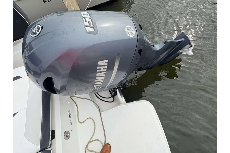 Slide: The Image of 2018 Regal 21 OBX with Yamaha 150 outboard motor on water. - 22